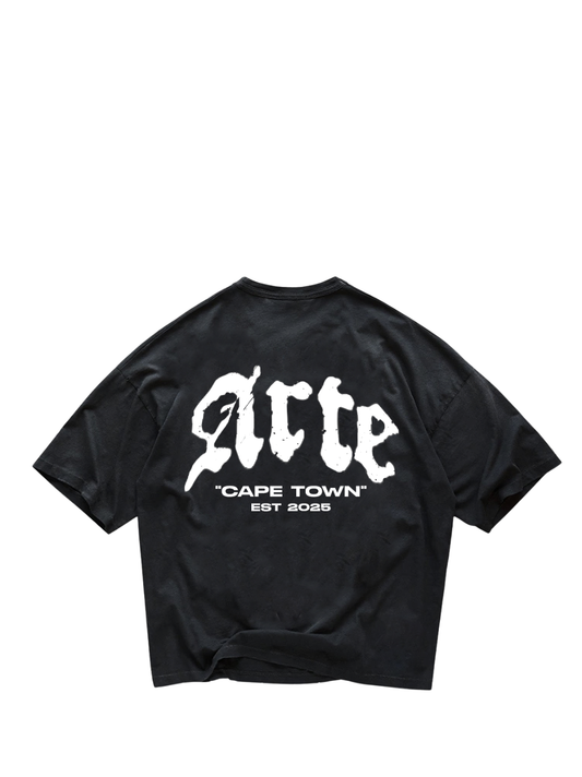 arte black oversized graphic t shirt at unseen grail. local brands south africa. streetwear. men and women. galxboy. bantu. el patron. flat lay image behind