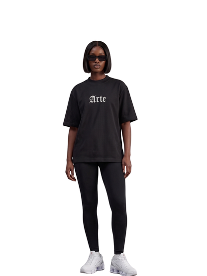 arte black oversized graphic t shirt at unseen grail. local brands south africa. streetwear. men and women. galxboy. bantu. el patron. front female model. streetwear