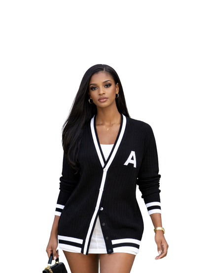 ascend black knitted cardigan jersey at unseen grail. local brands south africa. streetwear. men and women. studio image front galxboy and boys of soweto female model