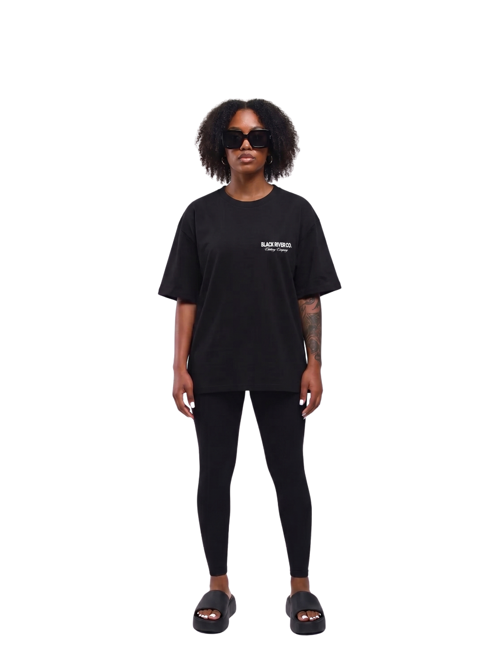 black river black oversized graphic t-shirt at unseen grail. local brands south africa. streetwear. men and women. studio image female model front. galxboy, bantu