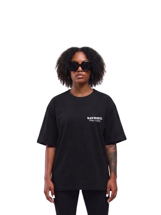 black river black oversized graphic t-shirt at unseen grail. local brands south africa. streetwear. men and women. studio image front female model. galxboy, bantu