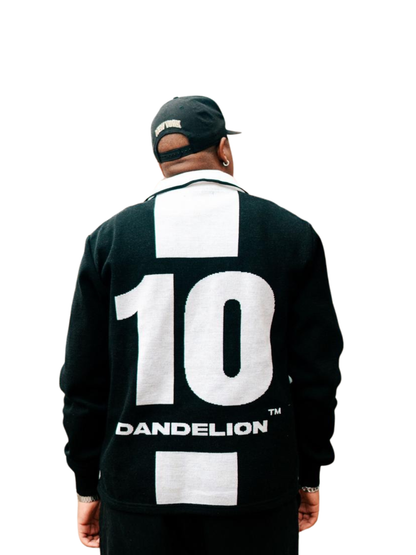 dandelion black and white knitwear sweater at unseen grail. local brands south africa. streetwear. men and women. studio image male model behind view close up