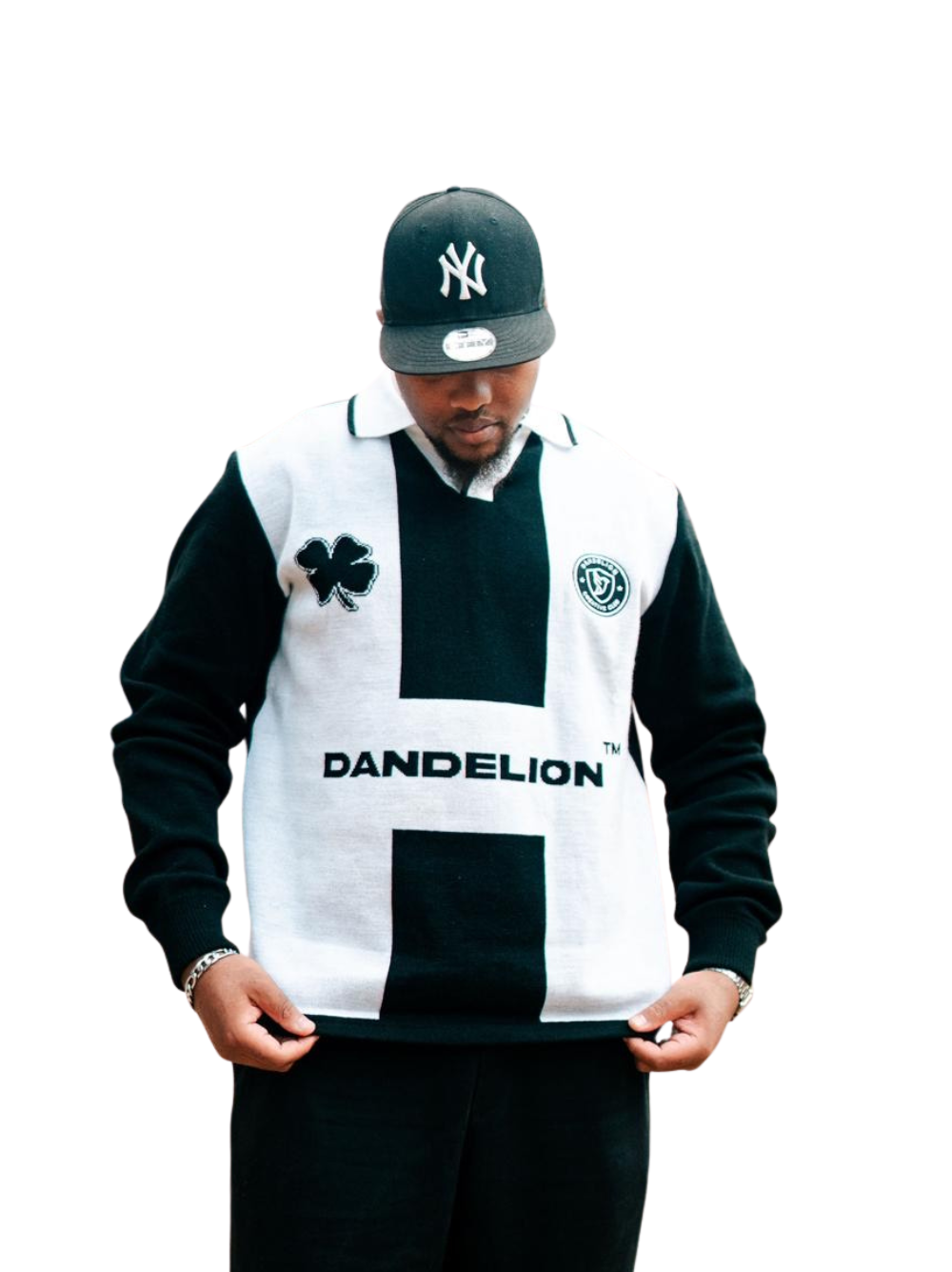 dandelion black and white knitwear sweater at unseen grail. local brands south africa. streetwear. men and women. studio image male model front view close up