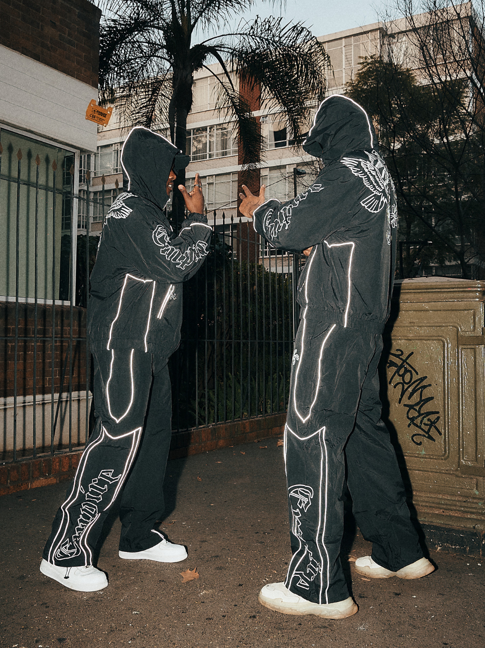 empire black oversized graphic tracksuit at unseen grail. local brands south africa. streetwear. men and women. group image galxboy, bantu men talking
