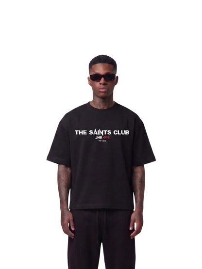 saint club black oversized tshirt at unseen grail. men and women. south africa top local brands all at unseen grail. studio image male model front