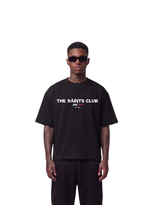 saint club black oversized tshirt at unseen grail. men and women. south africa top local brands all at unseen grail. studio image male model front