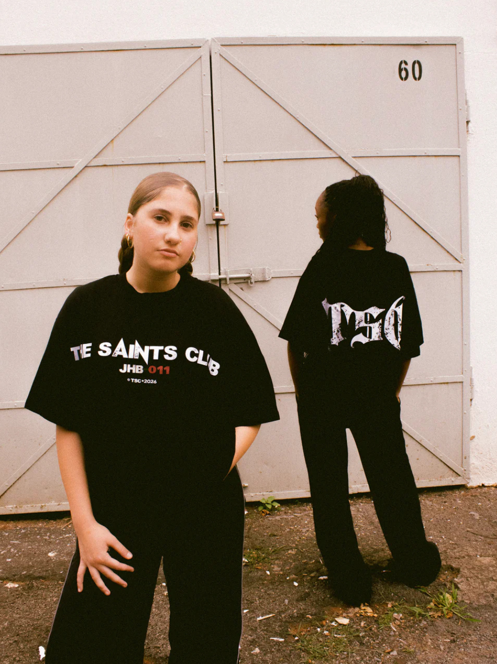 saint club black oversized tshirt at unseen grail. men and women. south africa top local brands all at unseen grail. studio image women