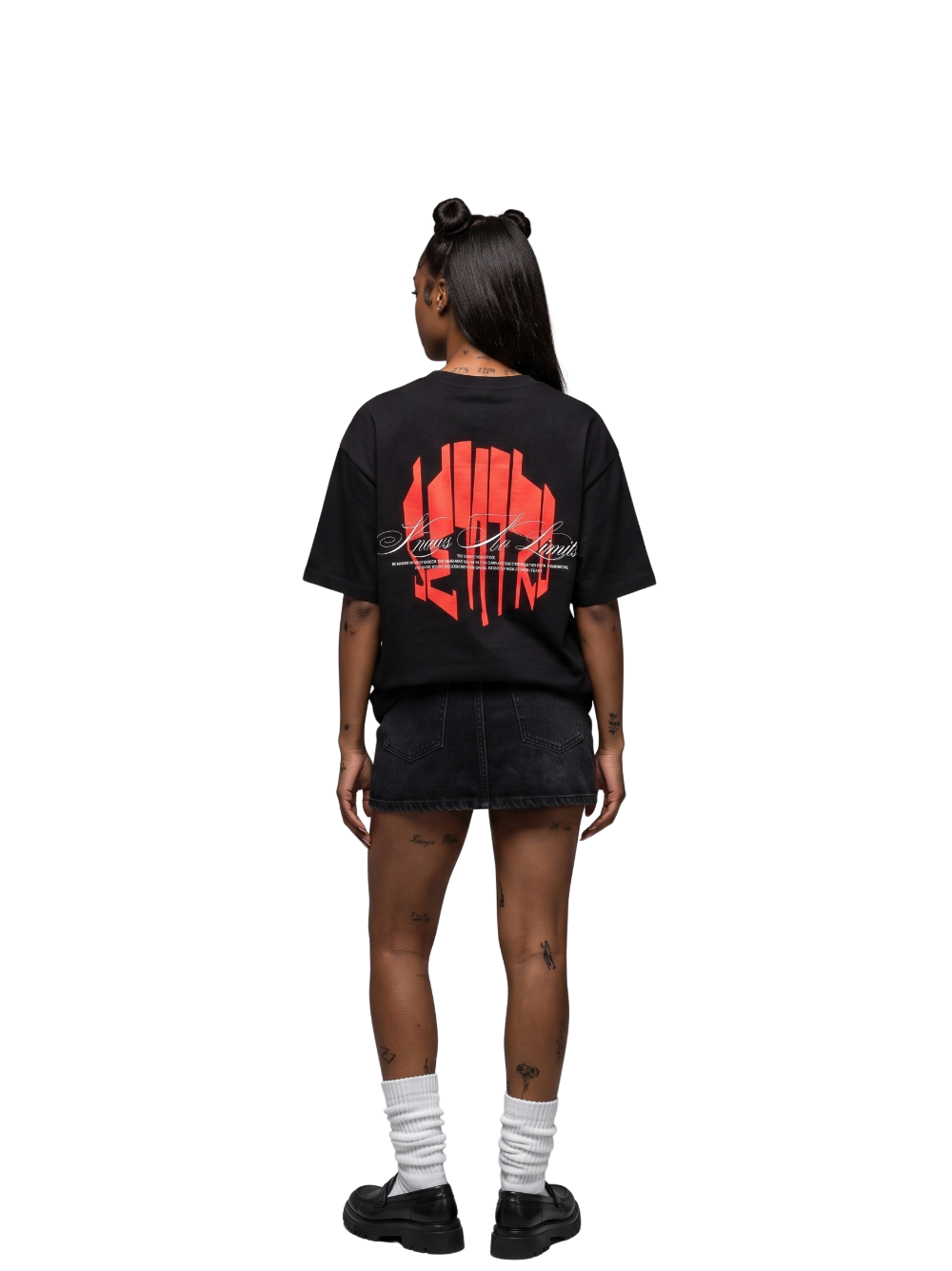 seniro black oversized graphic tshirt at unseen grail. local brands south africa. streetwear. men and women. female model behind studio image full outfit skirt