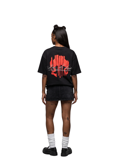 seniro black oversized graphic tshirt at unseen grail. local brands south africa. streetwear. men and women. female model behind studio image full outfit skirt
