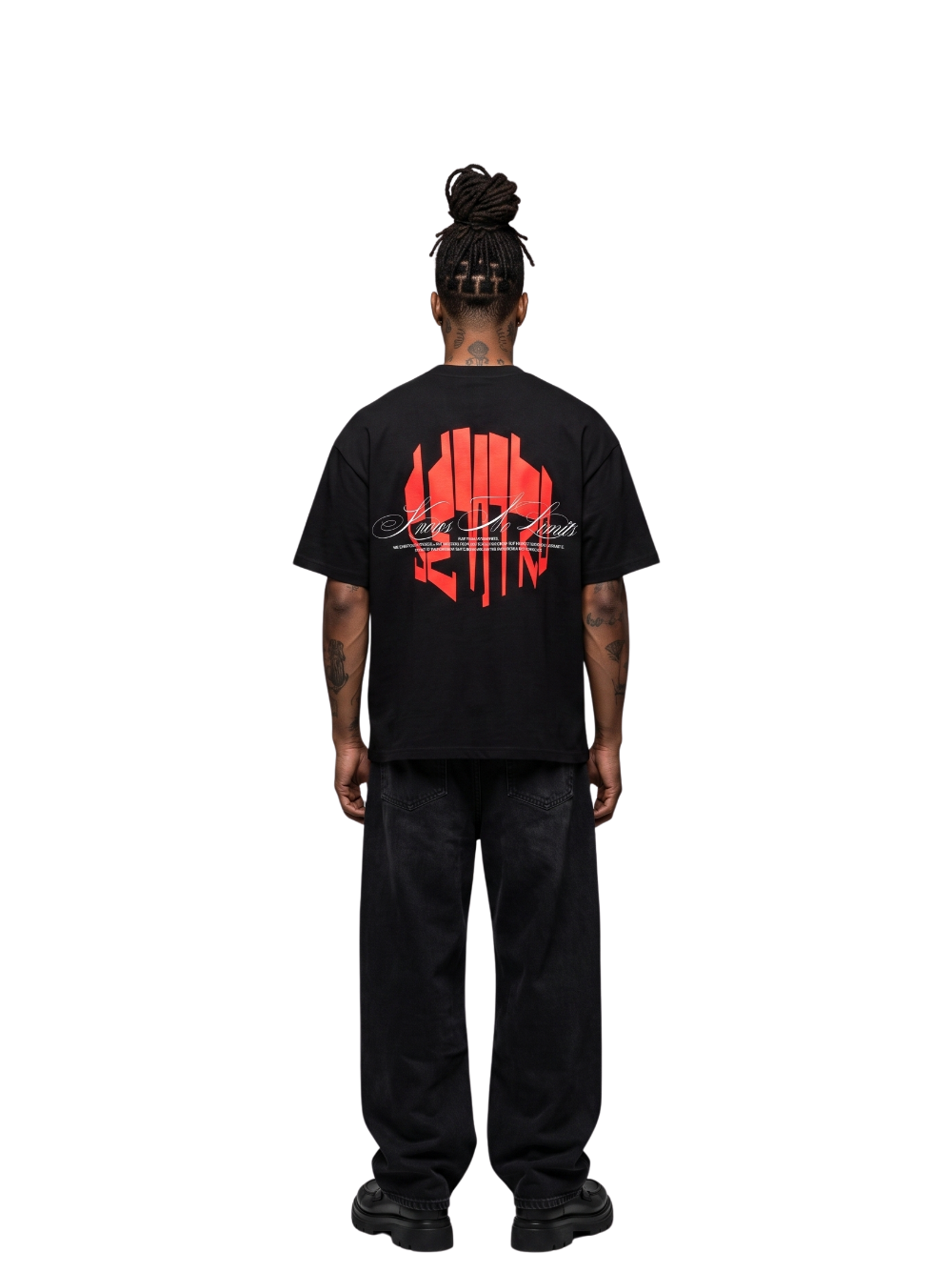 seniro black oversized graphic tshirt at unseen grail. local brands south africa. streetwear. men and women. male model behind studio image full outfit skirt