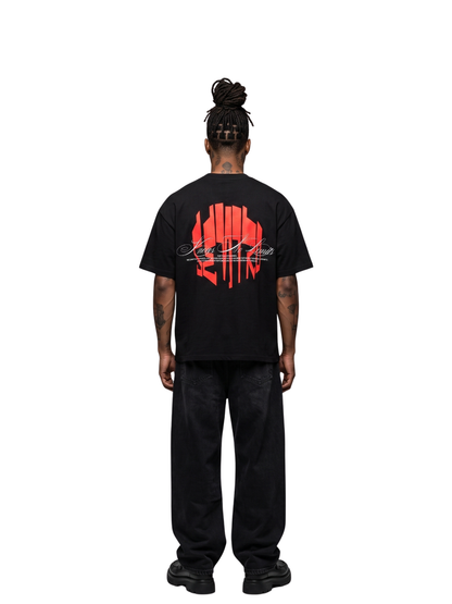 seniro black oversized graphic tshirt at unseen grail. local brands south africa. streetwear. men and women. male model behind studio image full outfit skirt