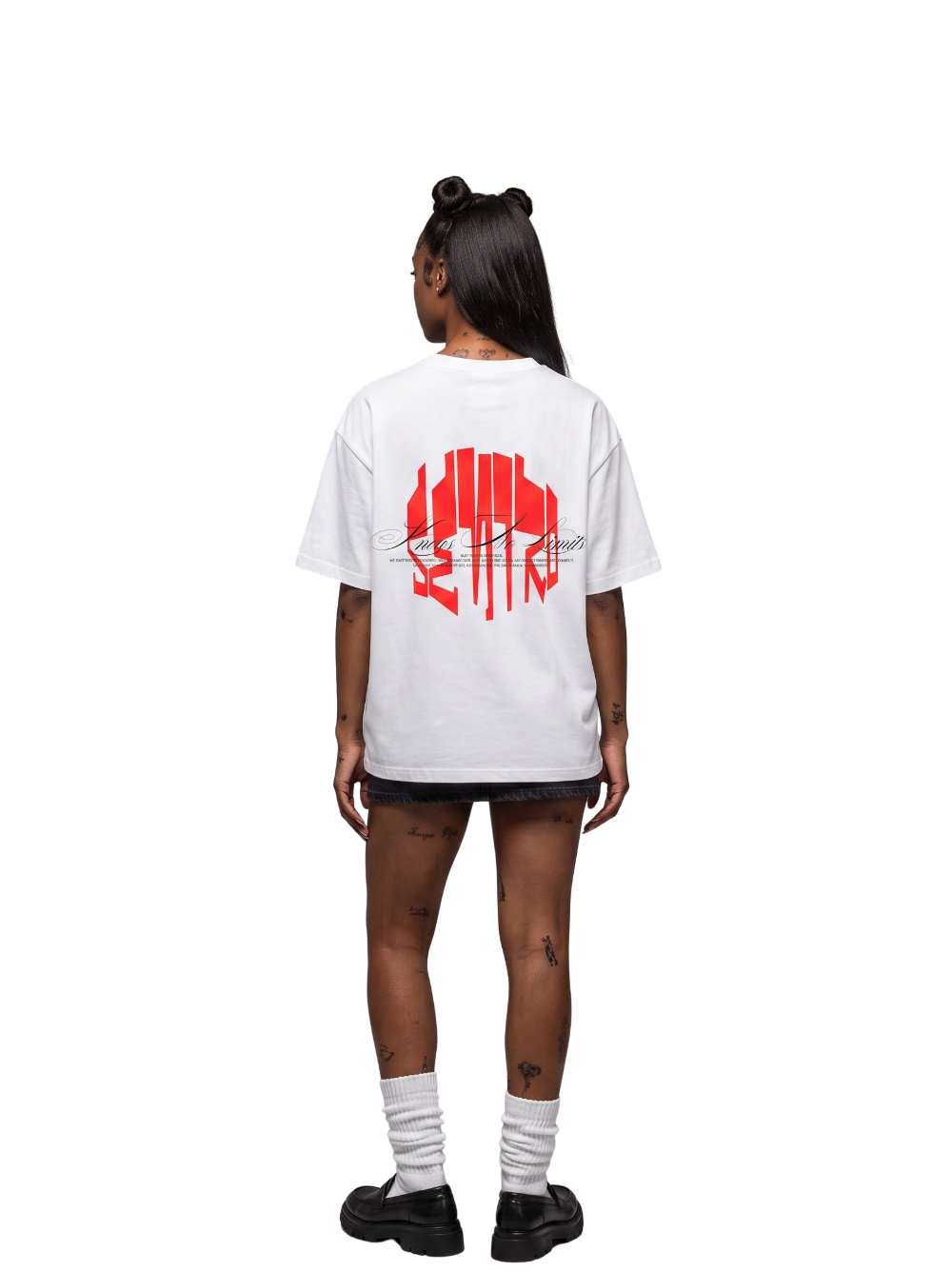 seniro white oversized graphic tshirt at unseen grail. local brands south africa. streetwear. men and women. studio image female model behind full outfit