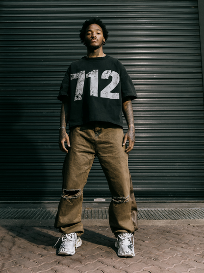 seventwelve studios black oversized tshirt at unseen grail. local brands south africa. streetwear. men and women. male model front full outfit