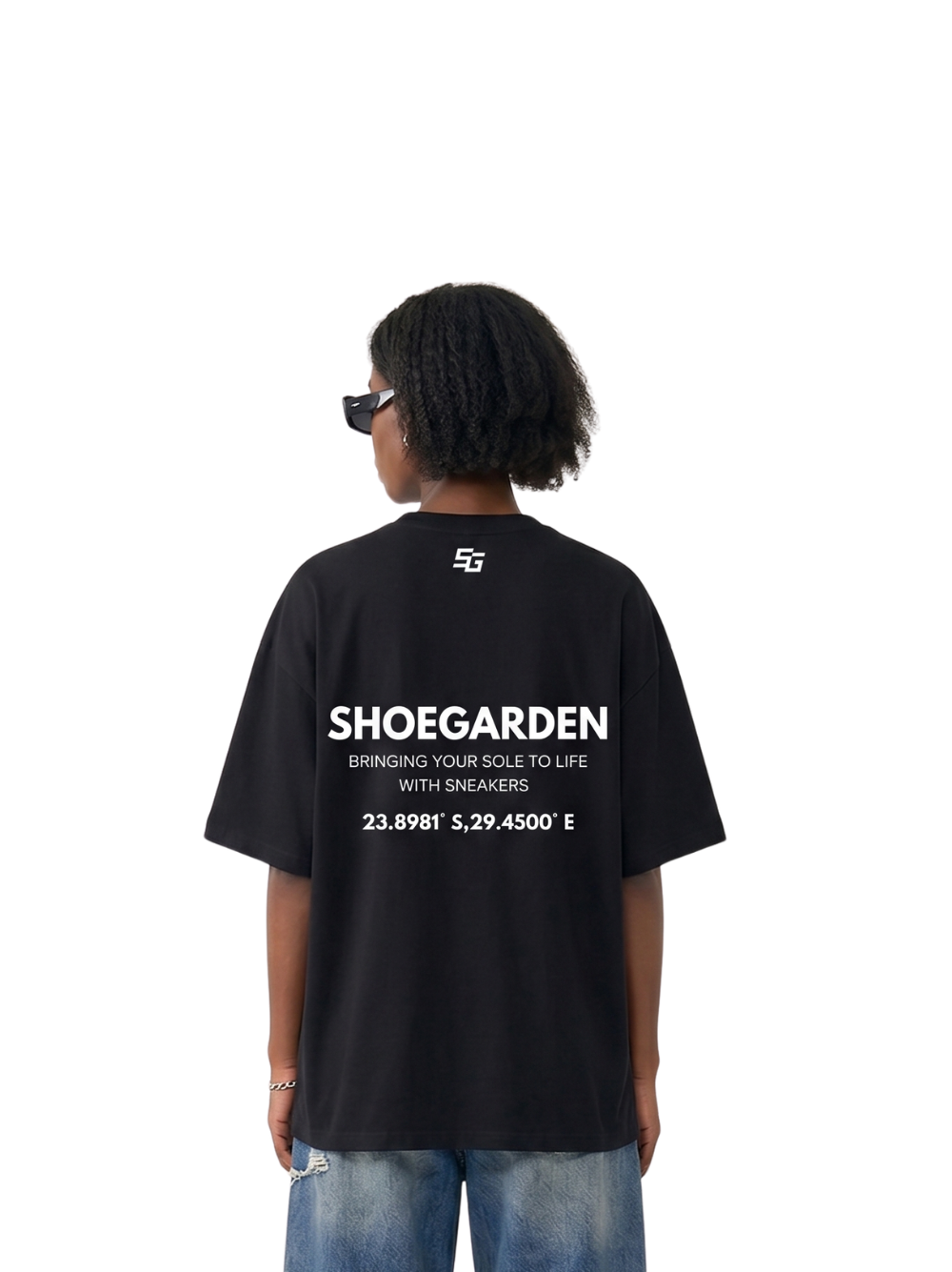 shoe garden black and white oversized tshirt at unseen grail. men and women. south africa top local brands all at unseen grail. studio image female model behind