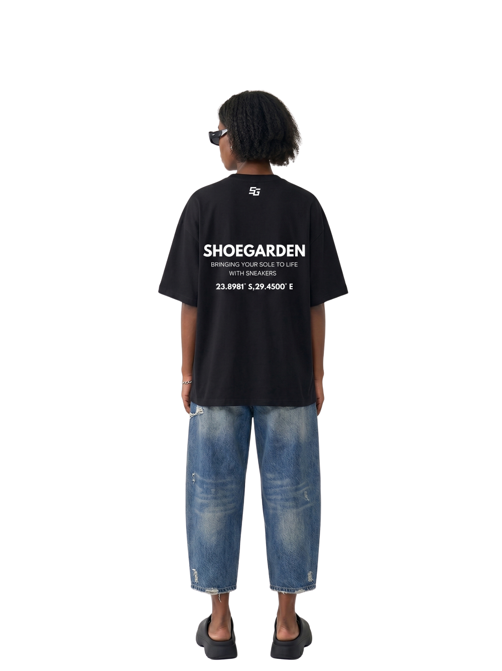 shoe garden black and white oversized tshirt at unseen grail. men and women. south africa top local brands all at unseen grail. studio image female model behind full outfit
