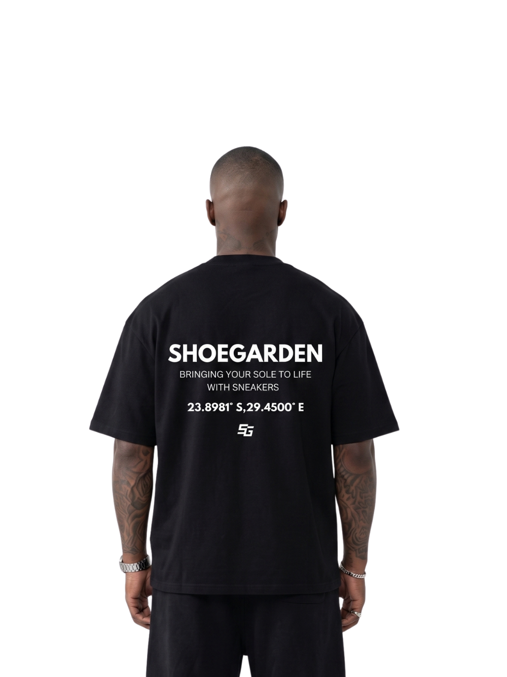 shoe garden black and white oversized tshirt at unseen grail. men and women. south africa top local brands all at unseen grail. studio image male model behind