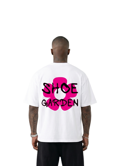 shoe garden white and pink oversized tshirt at unseen grail. men and women. south africa top local brands all at unseen grail. studio image behind male model