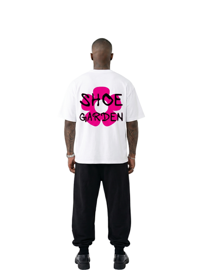 shoe garden white and pink oversized tshirt at unseen grail. men and women. south africa top local brands all at unseen grail. studio image male model behind