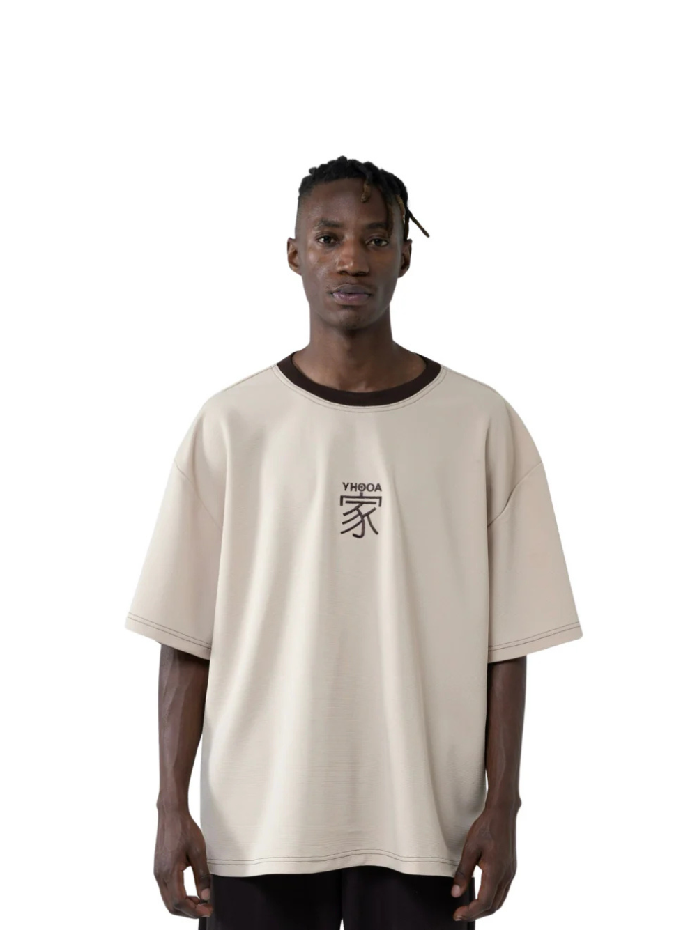 yhooa beige oversized graphic t shirt at unseen grail. local brands south africa. streetwear. men and women. studio image male model front