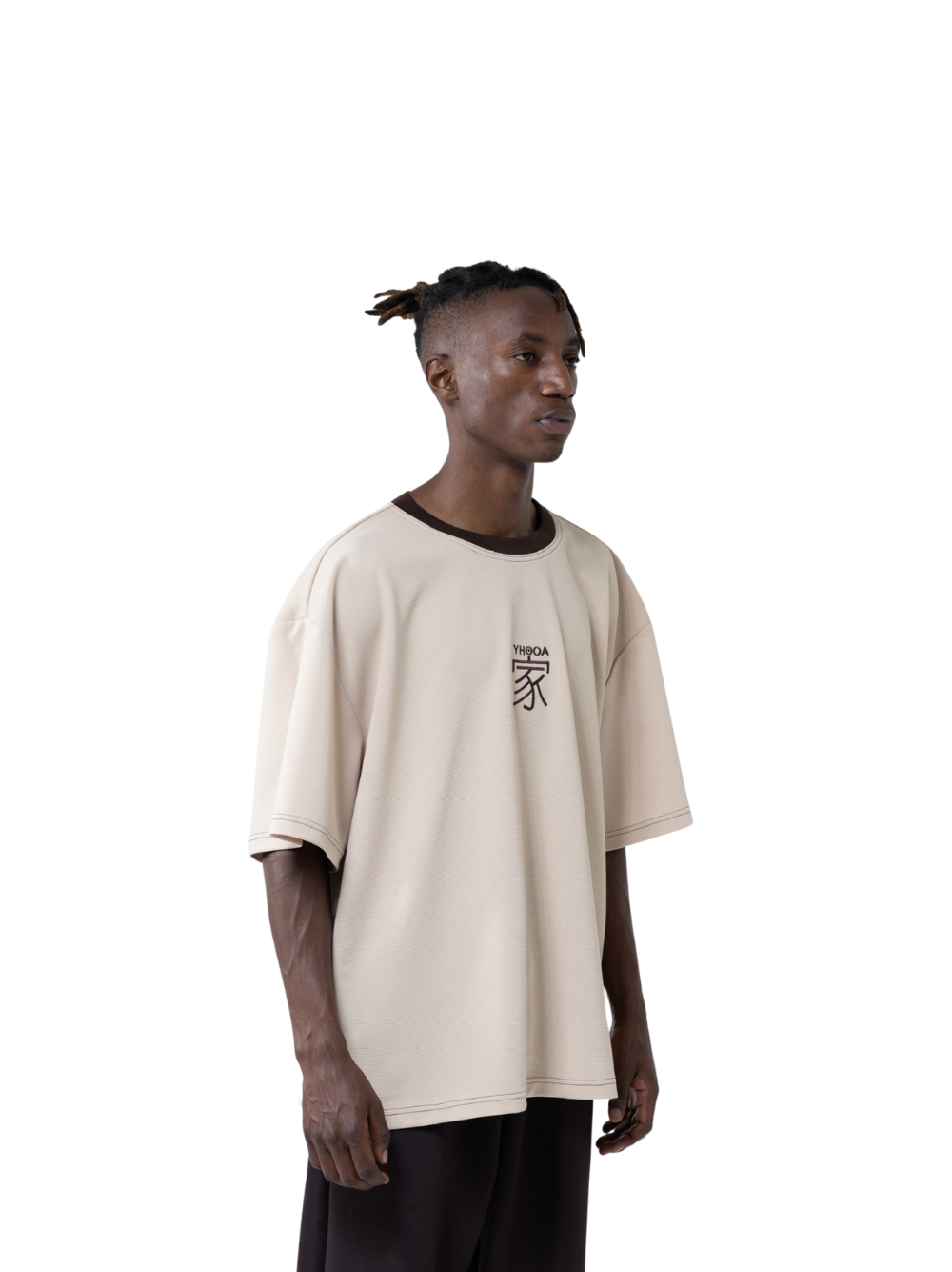 yhooa beige oversized graphic t shirt at unseen grail. local brands south africa. streetwear. men and women. studio image male model side