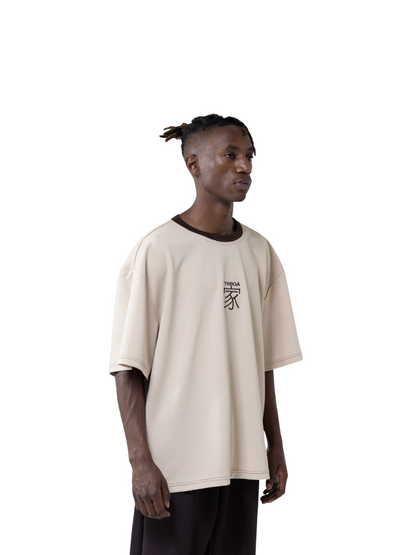 yhooa beige oversized graphic t shirt at unseen grail. local brands south africa. streetwear. men and women. studio image male model side