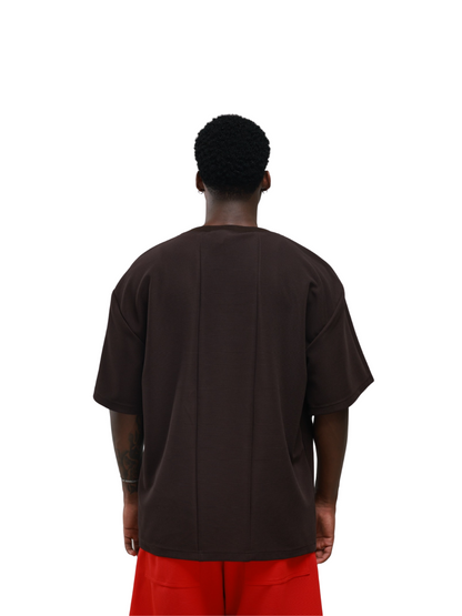 yhooa brown oversized graphic t shirt at unseen grail. local brands south africa. streetwear. men and women. studio image female model back