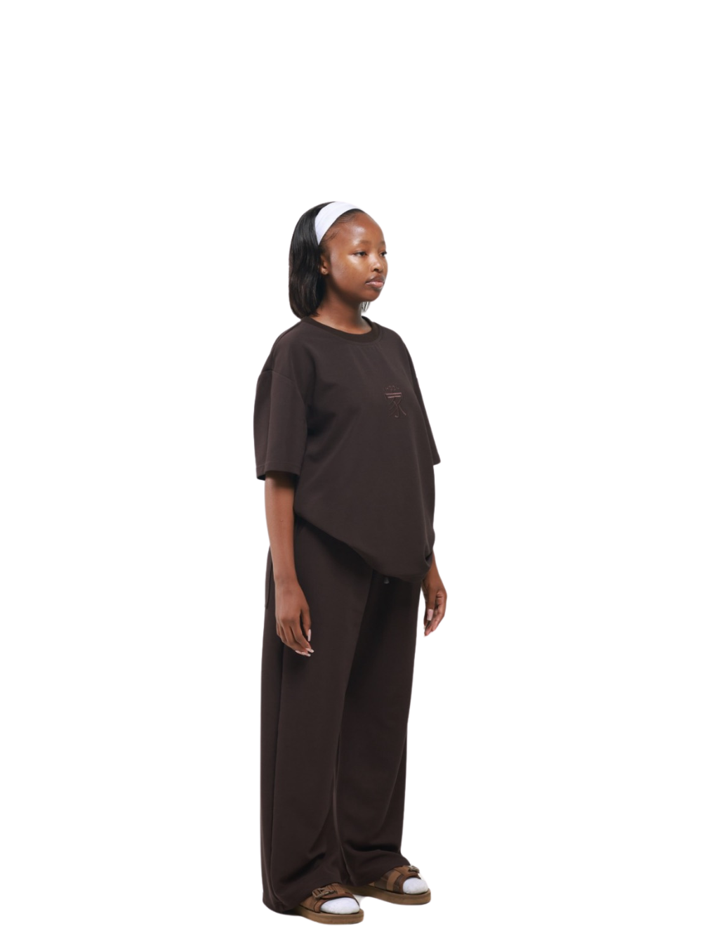 yhooa brown oversized graphic t shirt at unseen grail. local brands south africa. streetwear. men and women. studio image female model full outfit 1