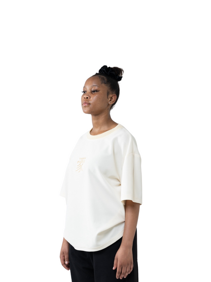 yhooa cream oversized graphic t shirt at unseen grail. local brands south africa. streetwear. men and women. studio image female model side